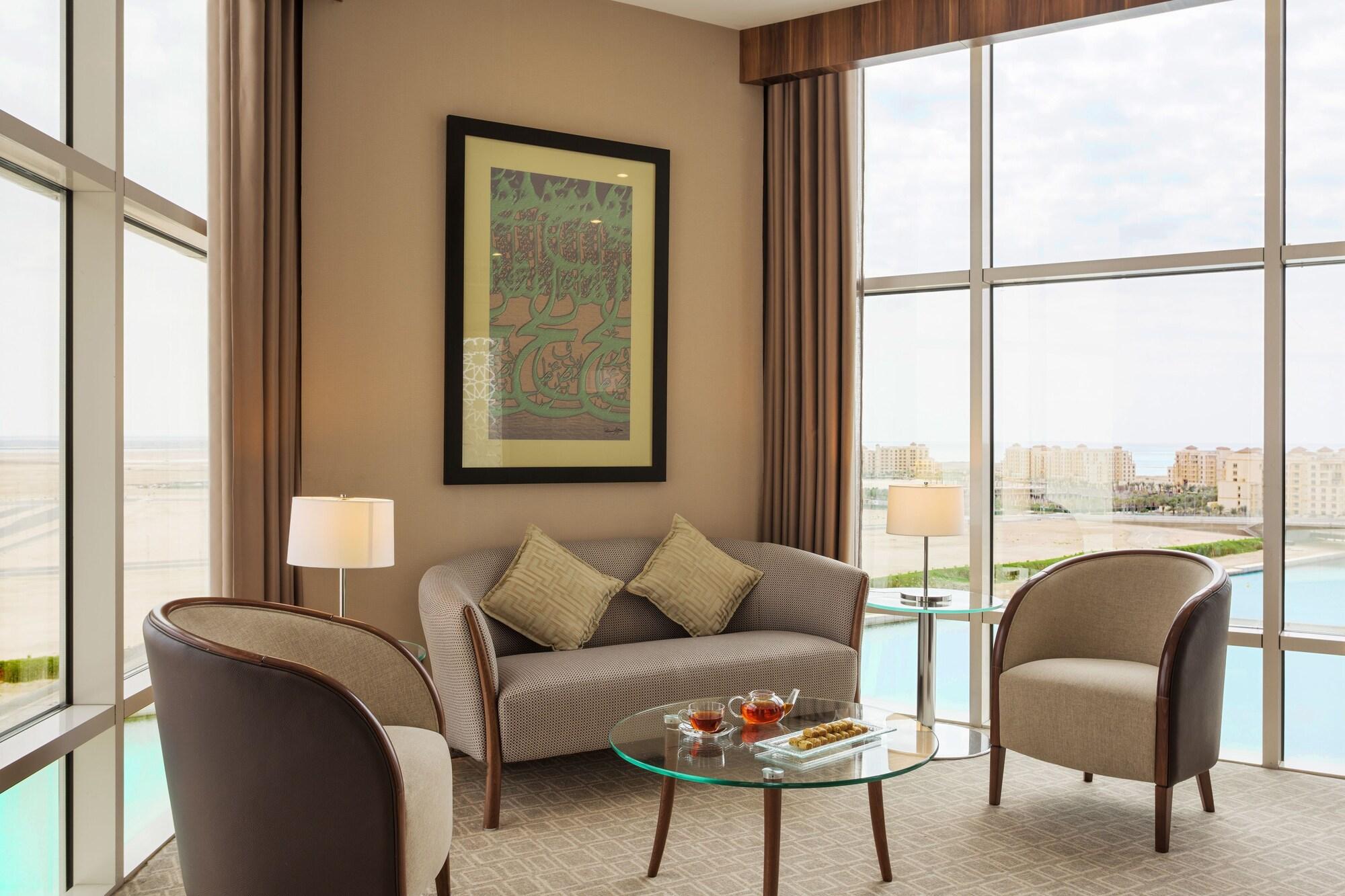 Bay La Sun Hotel And Marina - Emaar King Abdullah Economic City Экстерьер фото A living room in a suite at the hotel