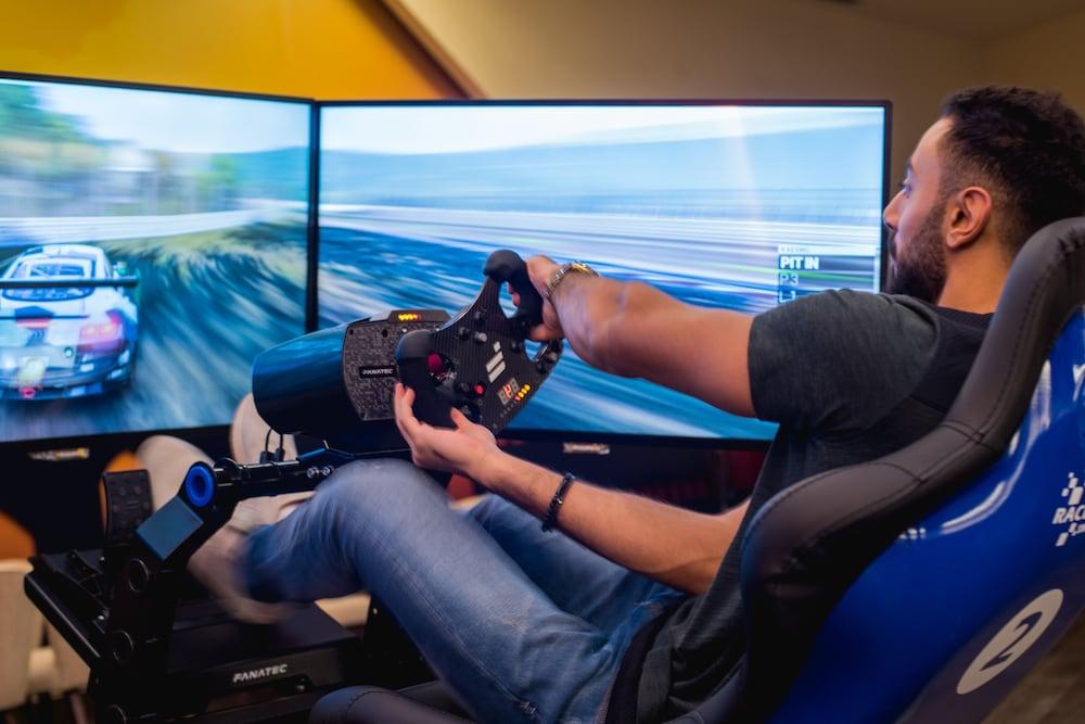 Bay La Sun Hotel And Marina - Emaar King Abdullah Economic City Экстерьер фото A racing game player using a steering wheel